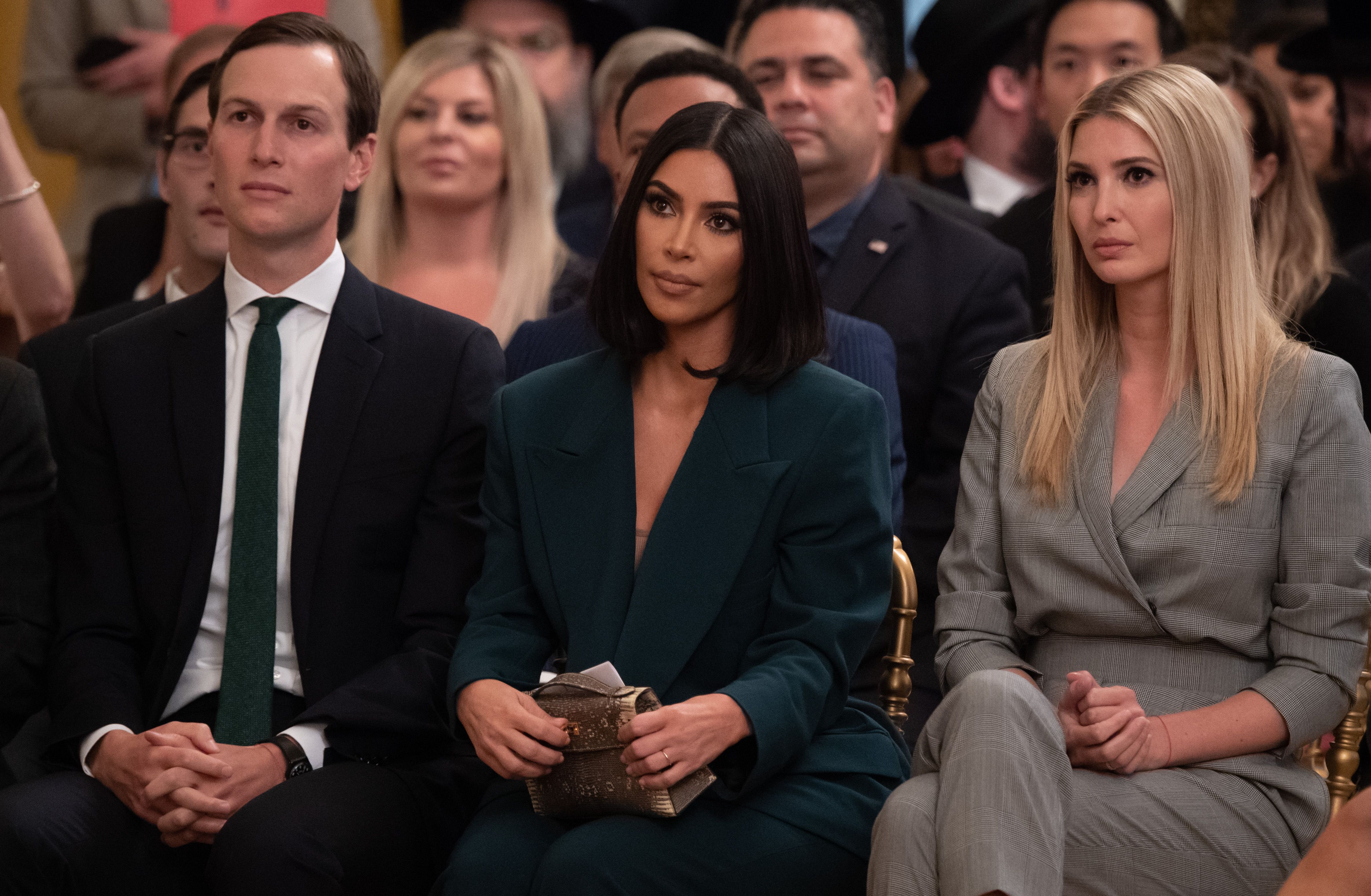 Kim Kardashian, Ivanka Trump, and Jared Kushner sitting in a row
