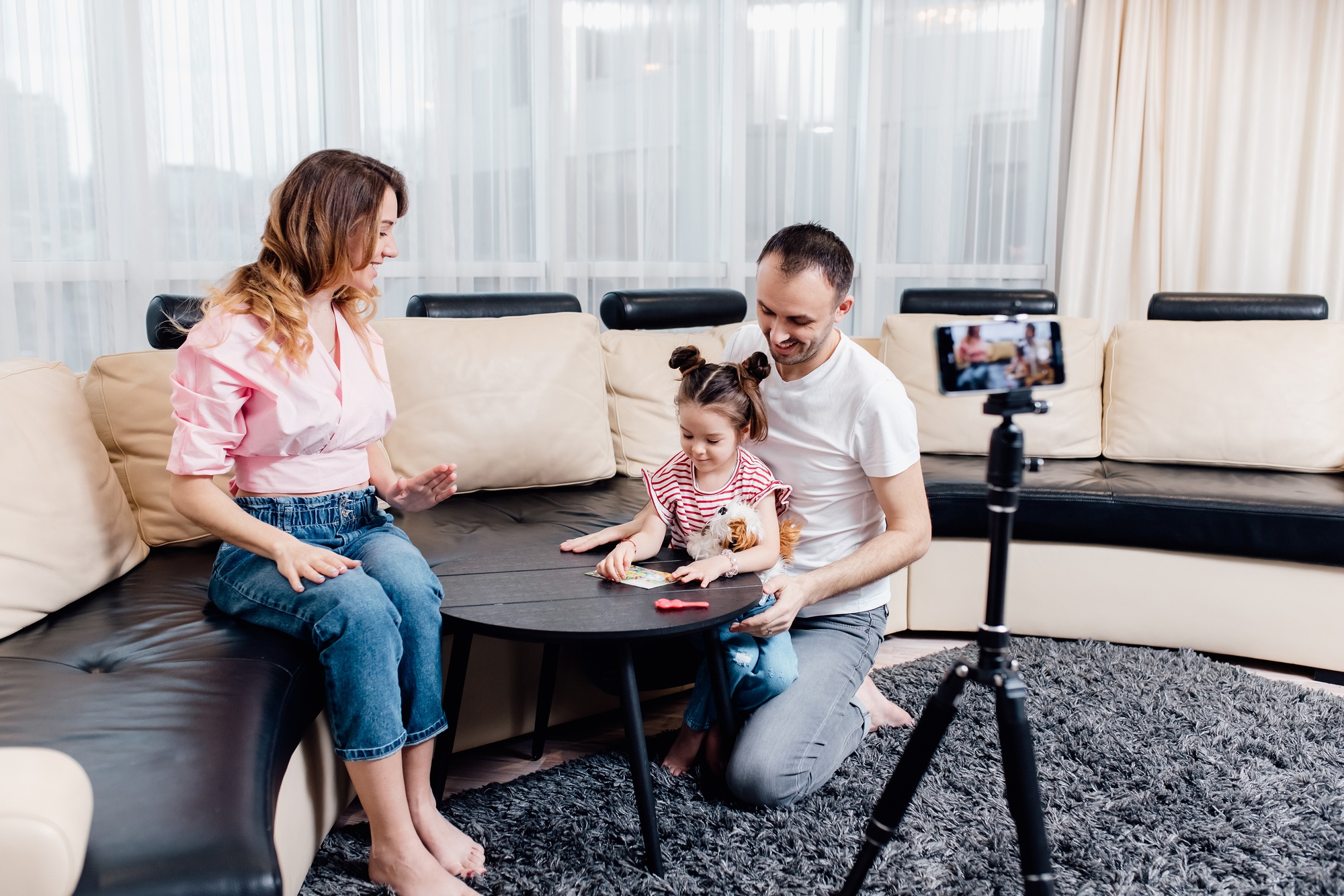 family blogger influencer recording video blog concept at smartphone on tripod at home.