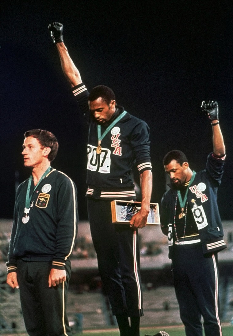 Tommie Smith, center, and John Carlos