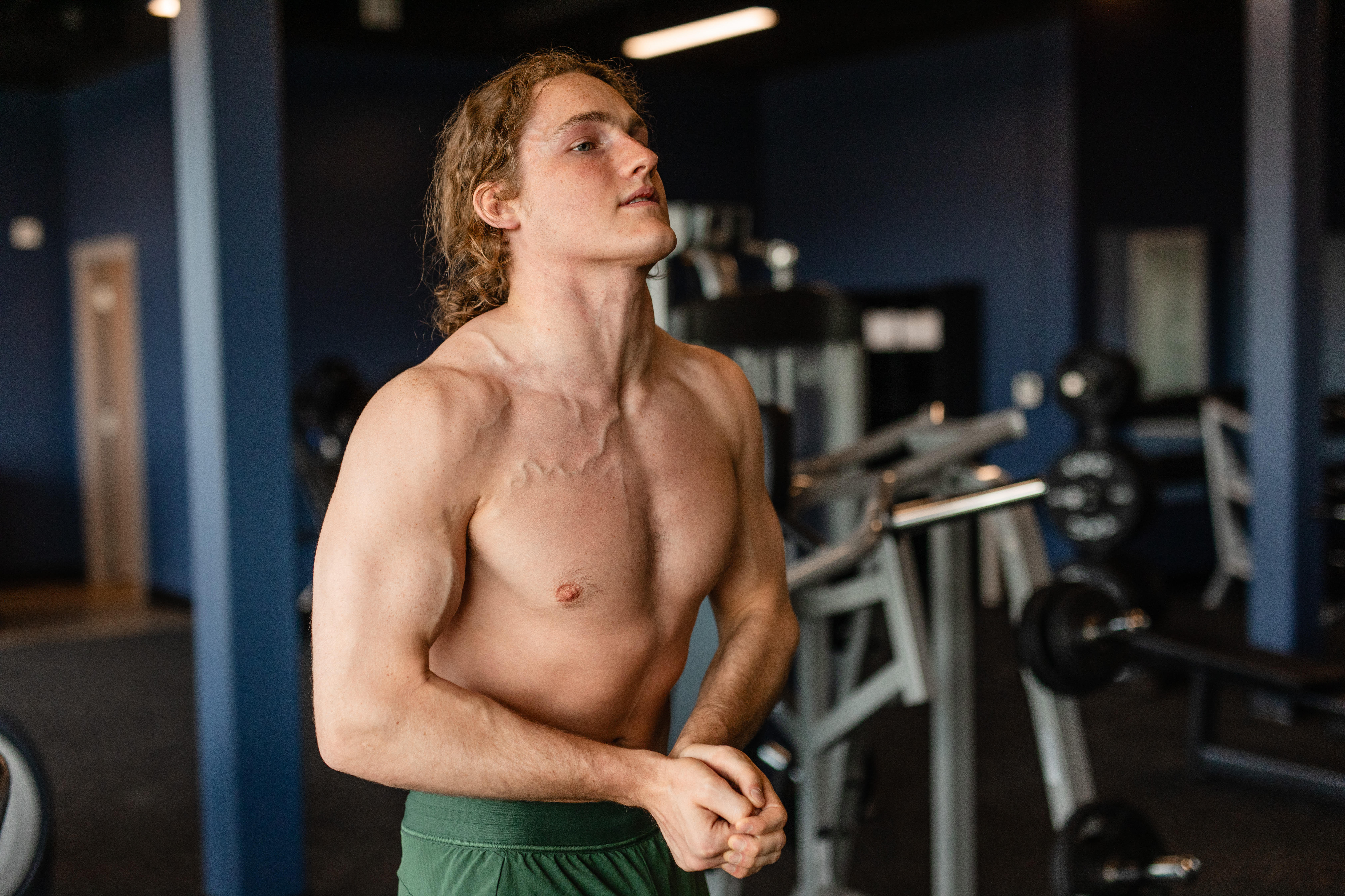 A shirtless man in the gym